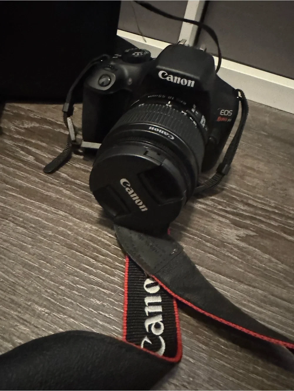 Canon Rebel T6 Camera with Black Body and Red-Trim Strap